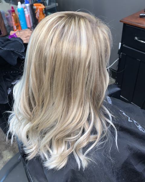 Blonde highlights on shoulder-length hair, seen from the back