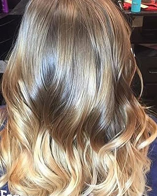 Balayage from brown to blonde in long waves