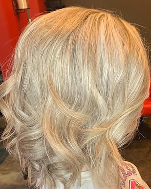 A smooth blonde bob with soft waves