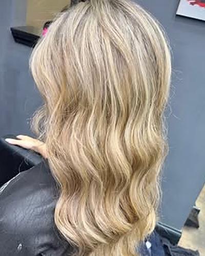 Creamy blonde waves, seen from the side
