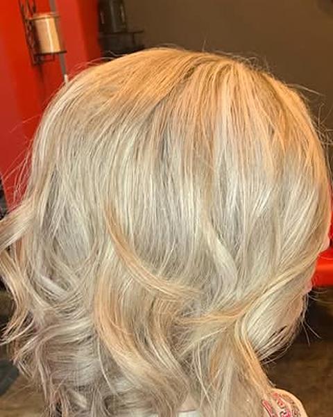 A blonde bob with soft waves